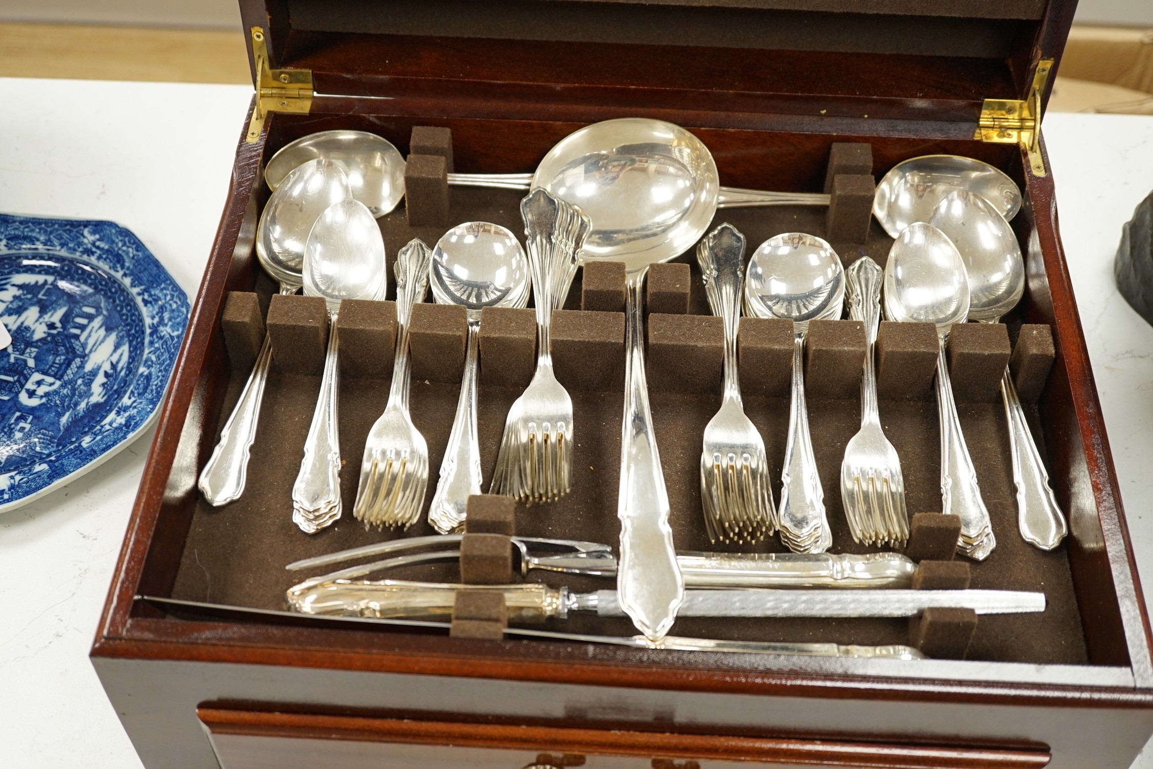 A silver plated two tier canteen of cutlery